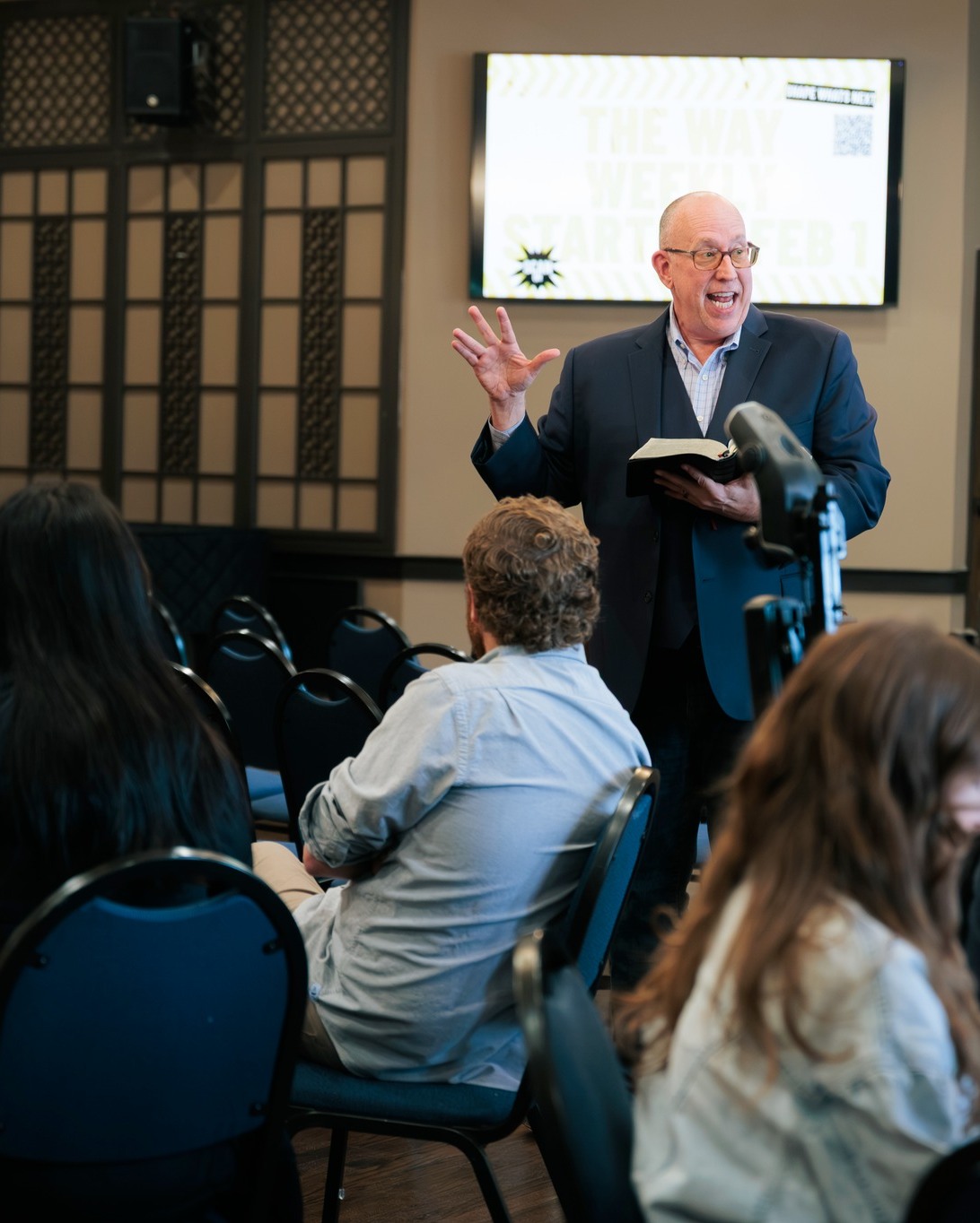 A teacher sharing from the Bible with a group at Nashville First