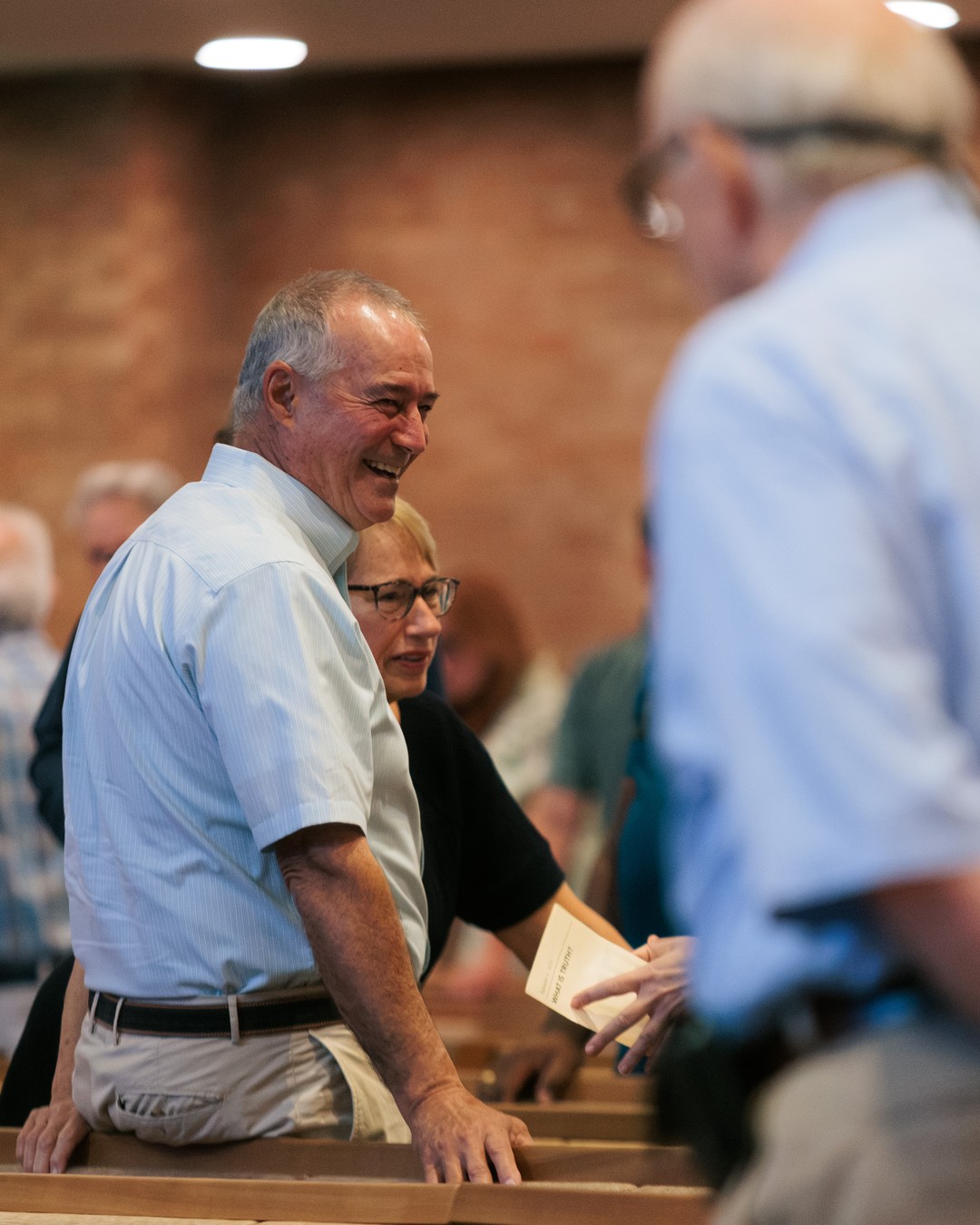 Church members greeting one another at Nashville First